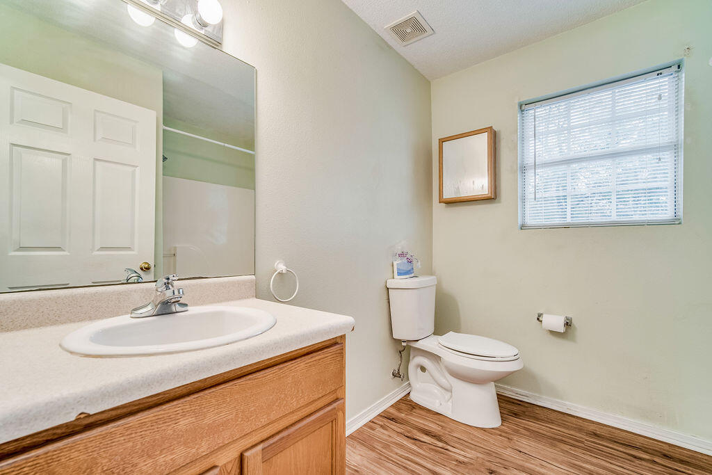 1003 Pinetree Road Mary Esther, FL 32569 - Photo 19 of 29 a bathroom with a sink toilet and a mirror