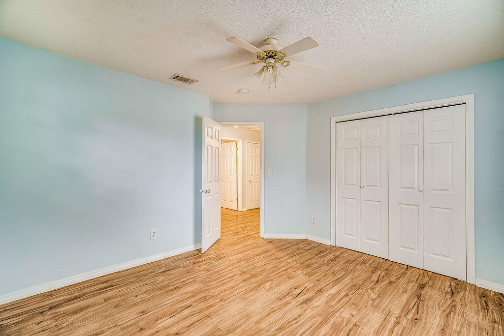 1003 Pinetree Road Mary Esther, FL 32569 - Photo 21 of 29 a view of an empty room and chandelier fan