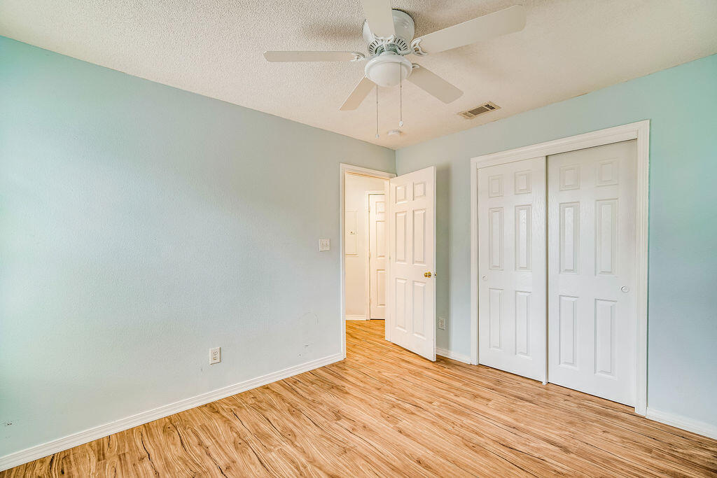 1003 Pinetree Road Mary Esther, FL 32569 - Photo 23 of 29 a view of empty room with wooden floor