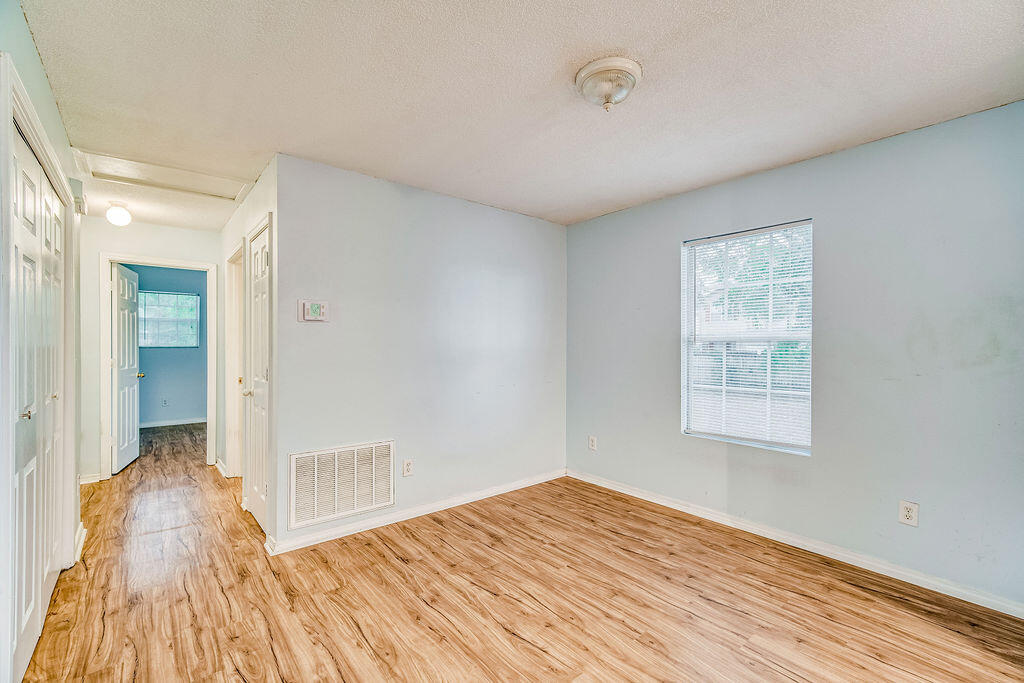 1003 Pinetree Road Mary Esther, FL 32569 - Photo 24 of 29 a view of a room with wooden floor and window