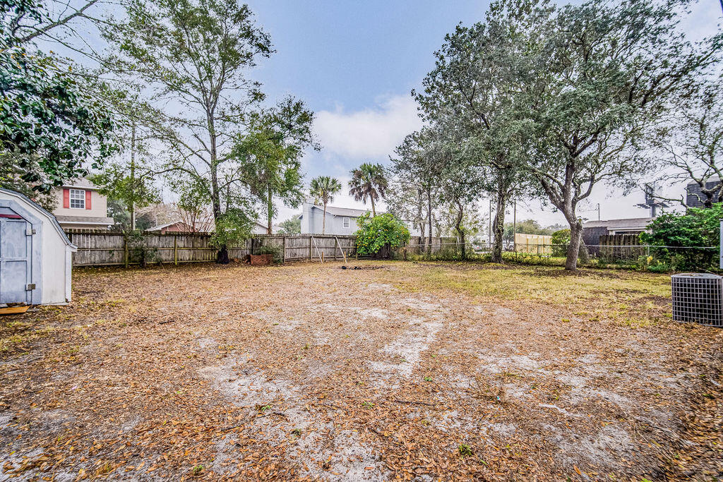 1003 Pinetree Road Mary Esther, FL 32569 - Photo 25 of 29 a view of a yard with cars