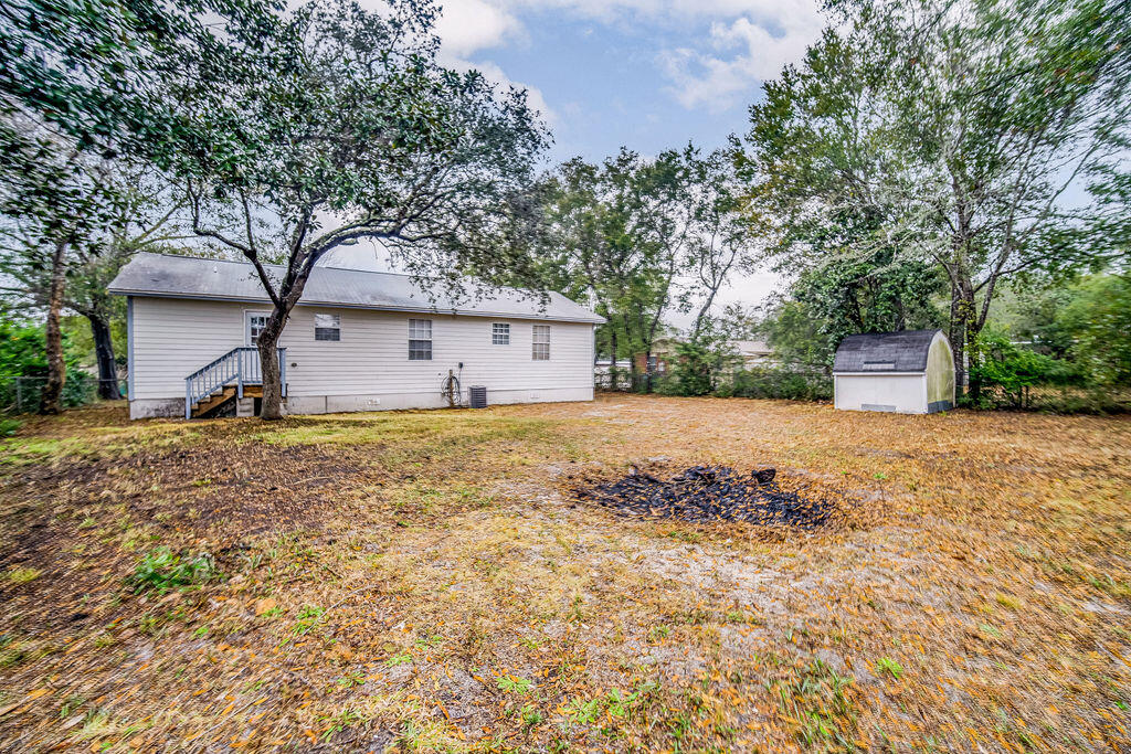 1003 Pinetree Road Mary Esther, FL 32569 - Photo 27 of 29 a front view of a house with a yard
