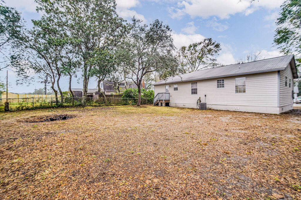 1003 Pinetree Road Mary Esther, FL 32569 - Photo 29 of 29 a front view of a house with a yard and garage