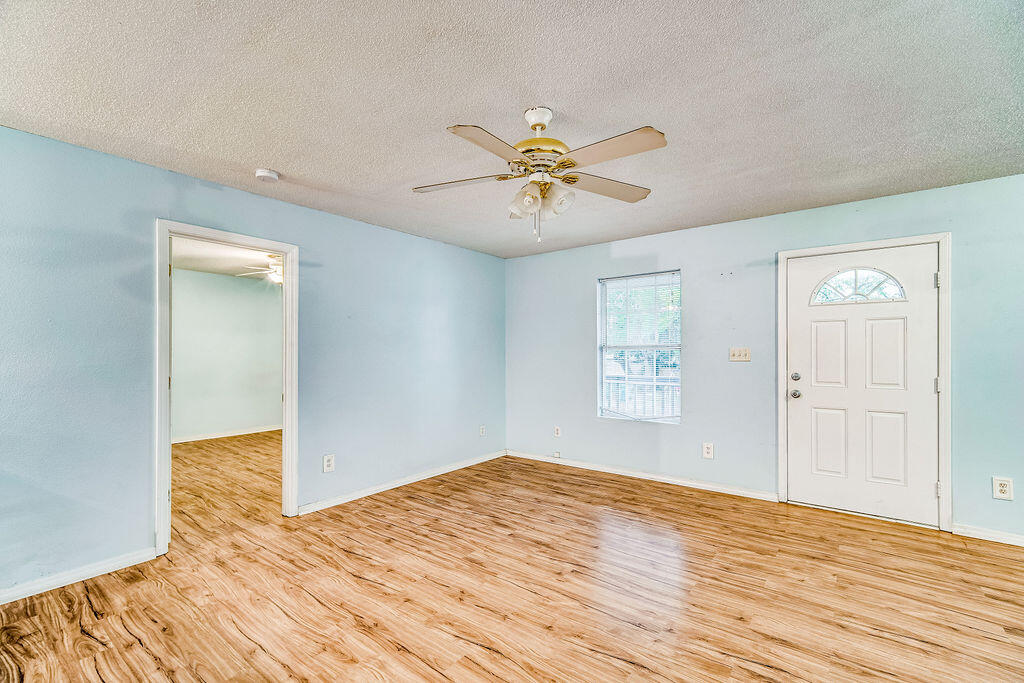 1003 Pinetree Road Mary Esther, FL 32569 - Photo 6 of 29 a view of empty room with wooden floor