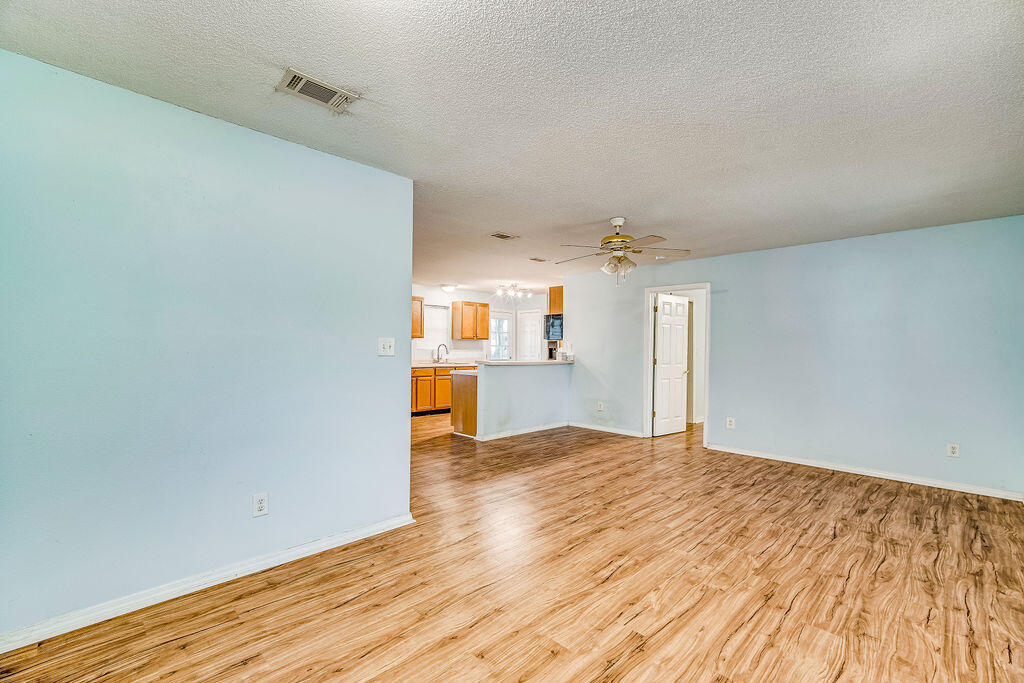 1003 Pinetree Road Mary Esther, FL 32569 - Photo 8 of 29 a view of a kitchen with wooden floor