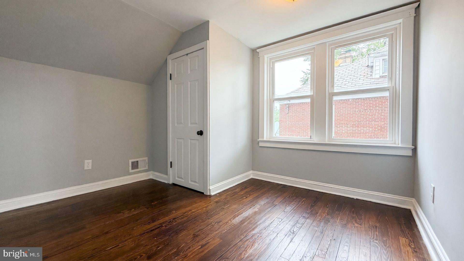 154 Andrew Street Hamilton, NJ 08610 - Photo 22 of 29 an empty room with wooden floor and windows