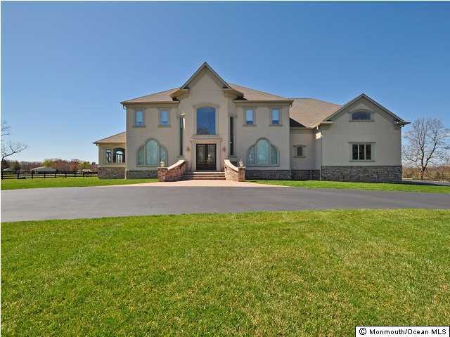 54 Harbor Road Morganville, NJ 07751 - Photo 1 of 3 a front view of a house with a yard
