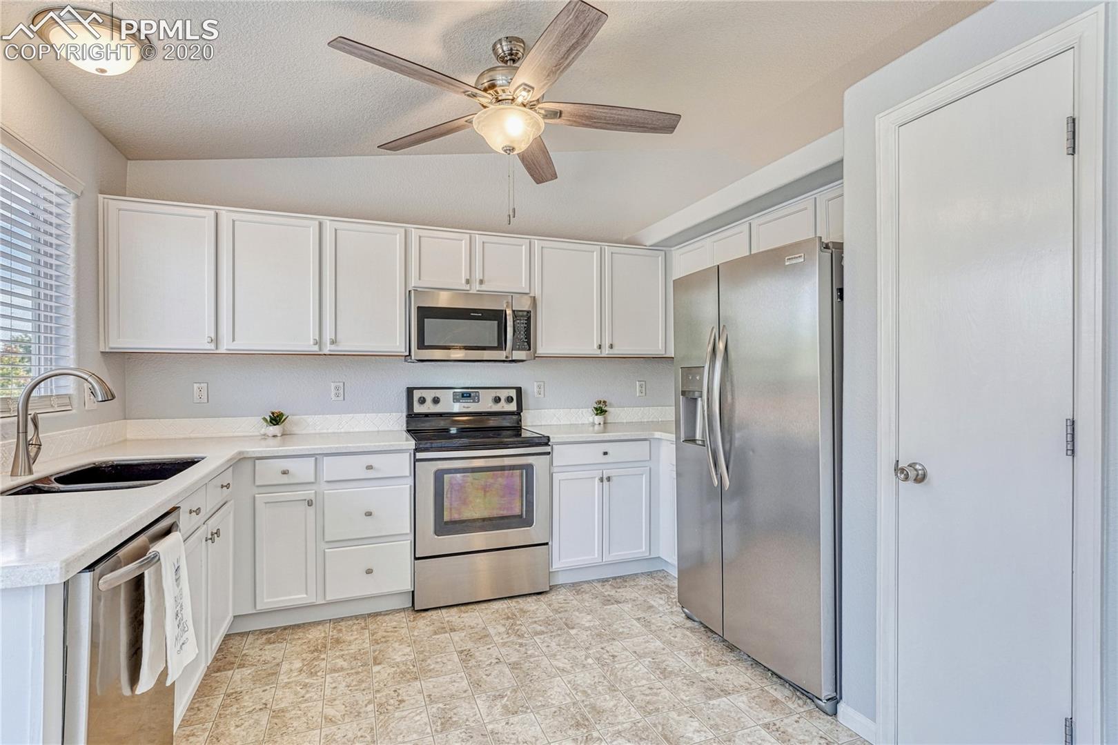 6554 Hannah Rose Road Colorado Springs, CO 80923 - Photo 9 of 29 ...pantry, Corian countertops...