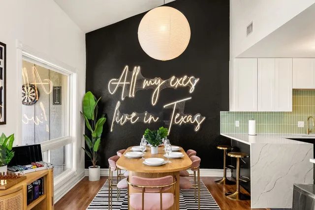 a kitchen with a table and chairs in it