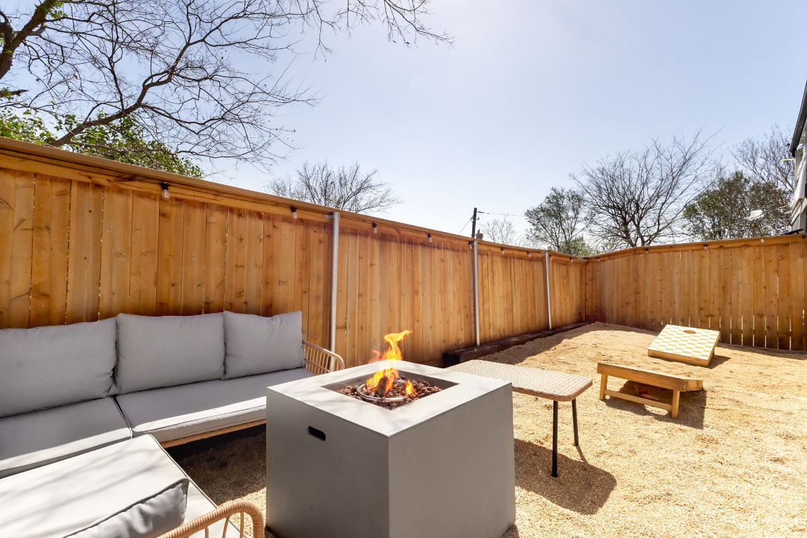 3306 Hyclimb Circle, Unit A Austin, TX 78723 - Photo 23 of 26 a backyard of a house with couches wooden floor and fence
