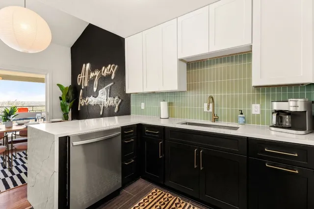 a kitchen with a sink and cabinets