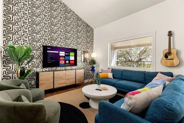 a living room with furniture and a flat screen tv