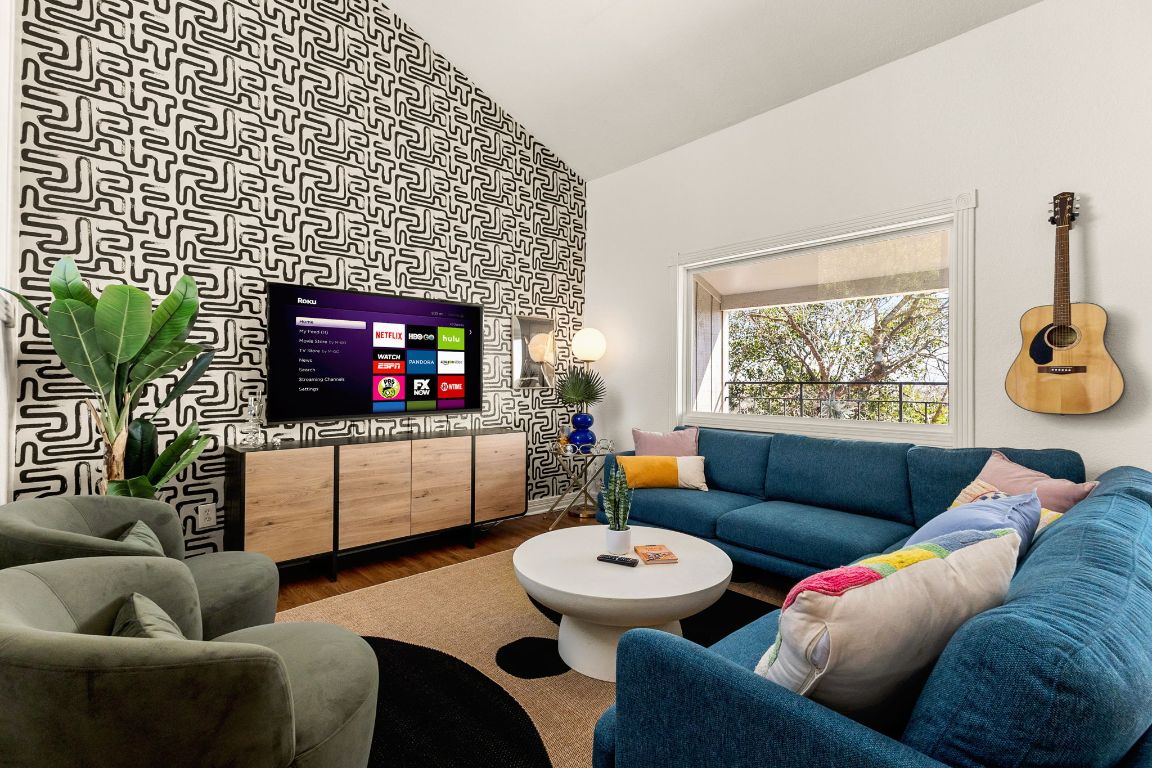 3306 Hyclimb Circle, Unit A Austin, TX 78723 - Photo 10 of 26 a living room with furniture and a flat screen tv