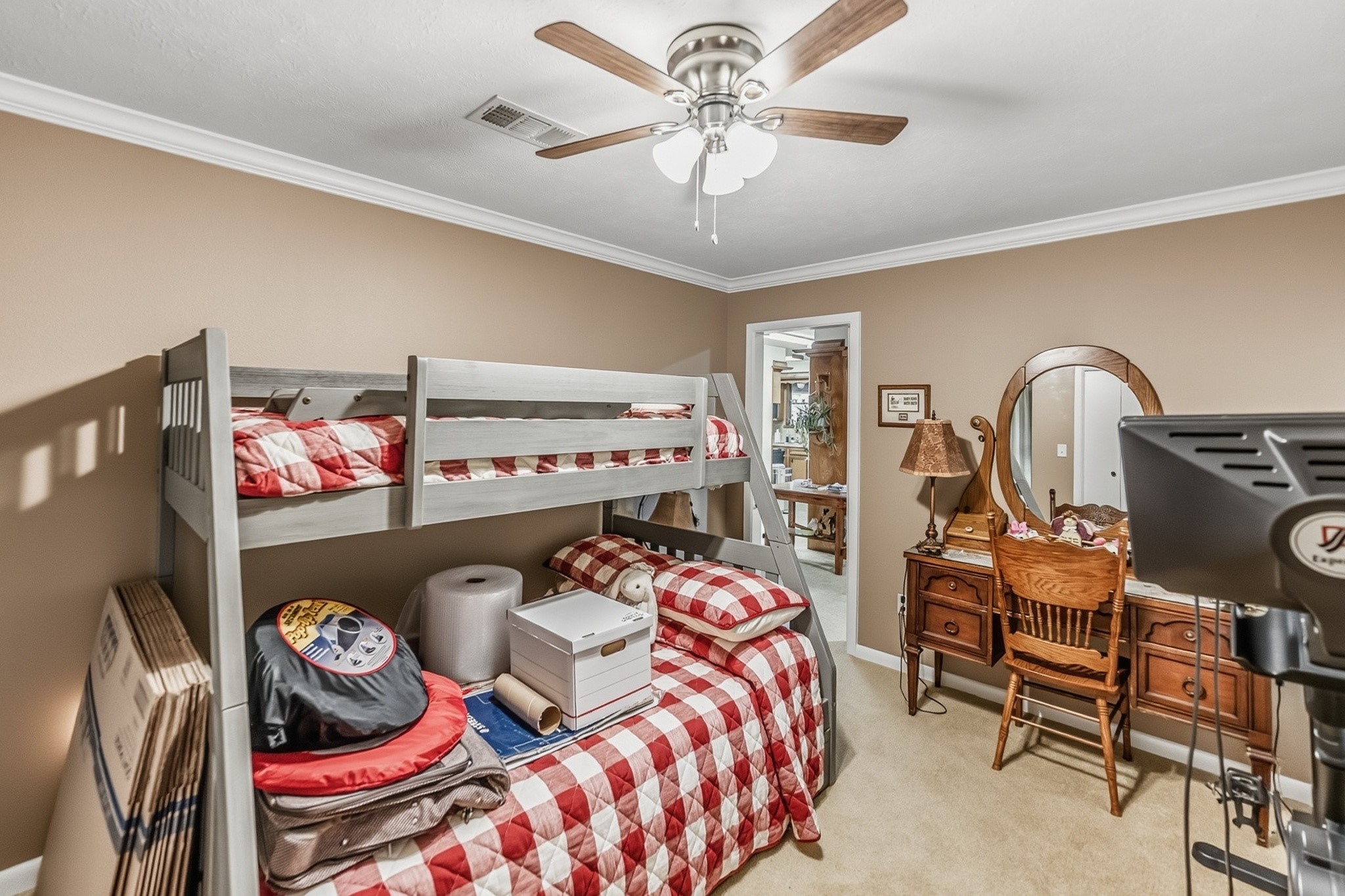 46 Point Loop Huntsville, TX 77320 - Photo 24 of 49 a bedroom with stainless steel appliances a rug and a chandelier