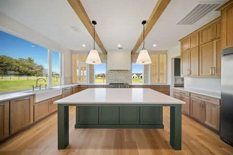 a room with pool table and windows