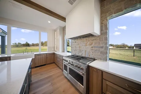 a kitchen with a stove and a refrigerator