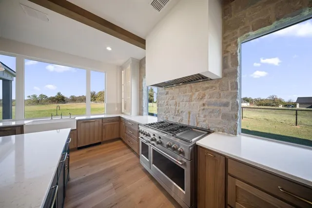 a kitchen with a stove and a refrigerator