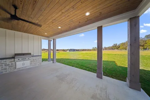 a view of a living room with a large window