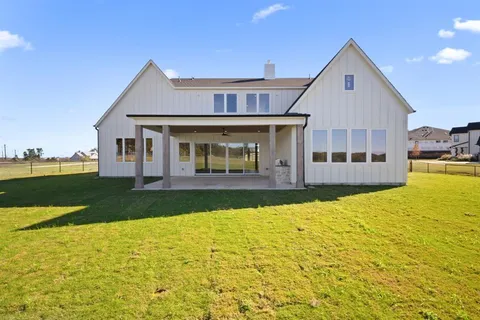 a view of a house with swimming pool