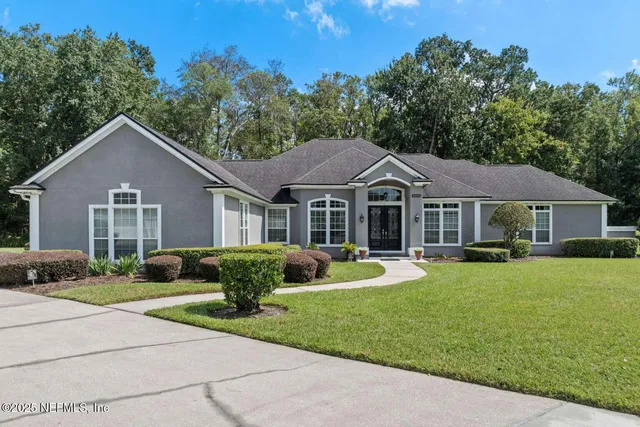 a front view of a house with garden and porch