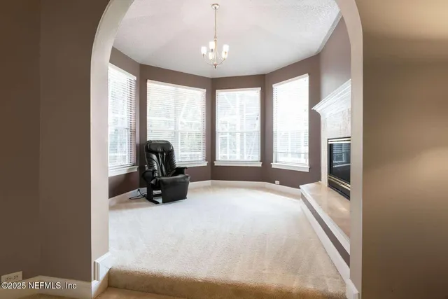 a bed room with a bed and a large window