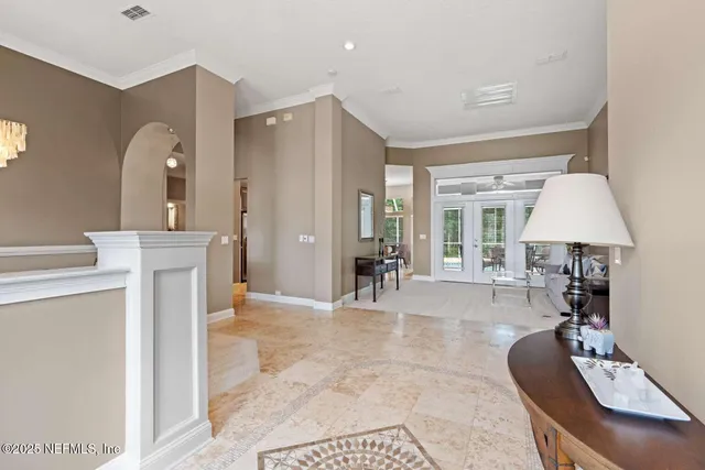 a living room with furniture and a table