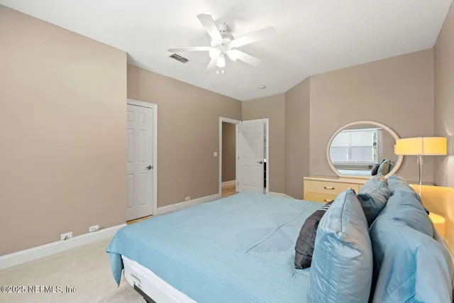 a view of bathroom with a sink and a mirror