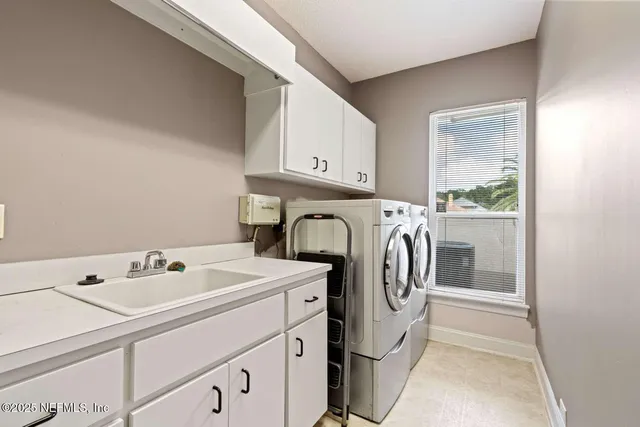 a view of a dining room with furniture large windows and wooden floor