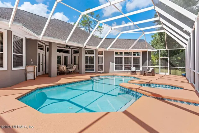 a view of swimming pool with a patio