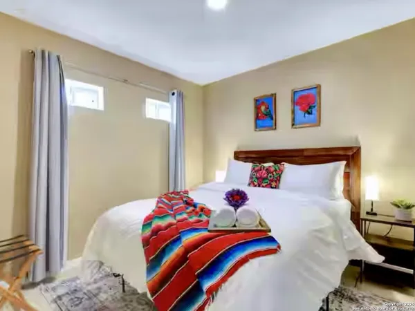 a bedroom with a bed and a dresser