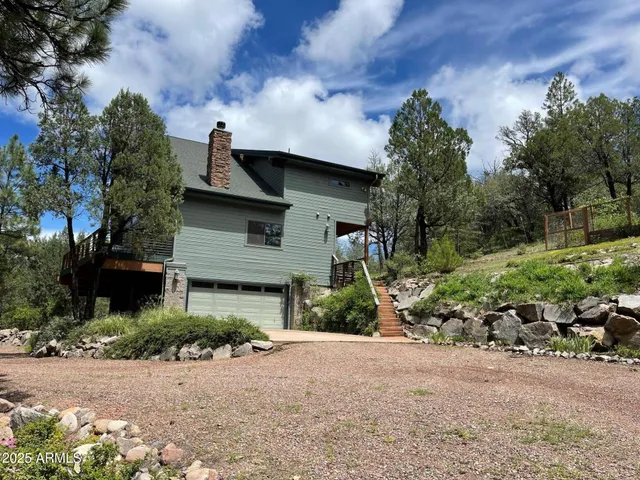 a front view of a house with a yard and pathway