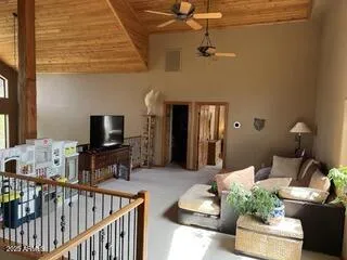 a living room with furniture and a lamp