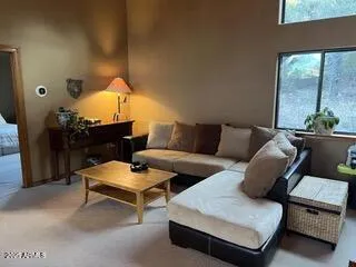 a bedroom with furniture and a chandelier