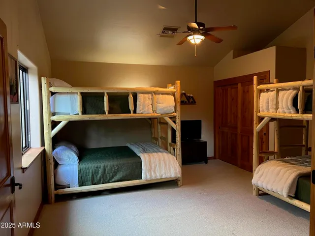 a bedroom with a bed and a mirror