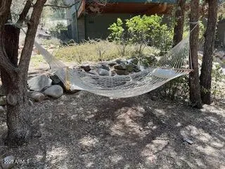 a view of a table and chairs in the garden