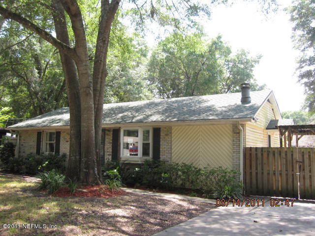 1360 Prince Road St. Augustine, FL 32086 - Photo 1 of 8 a front view of a house with garden