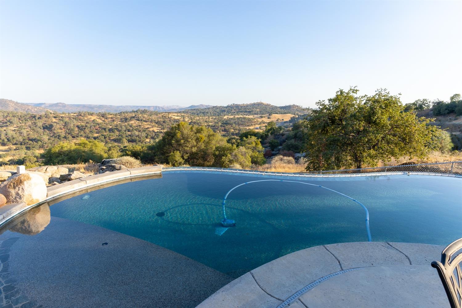 28067 Circle J Ranch Road O'Neals, CA 93645 - Photo 13 of 45 Saltwater infinity pool for the hot summer days.
