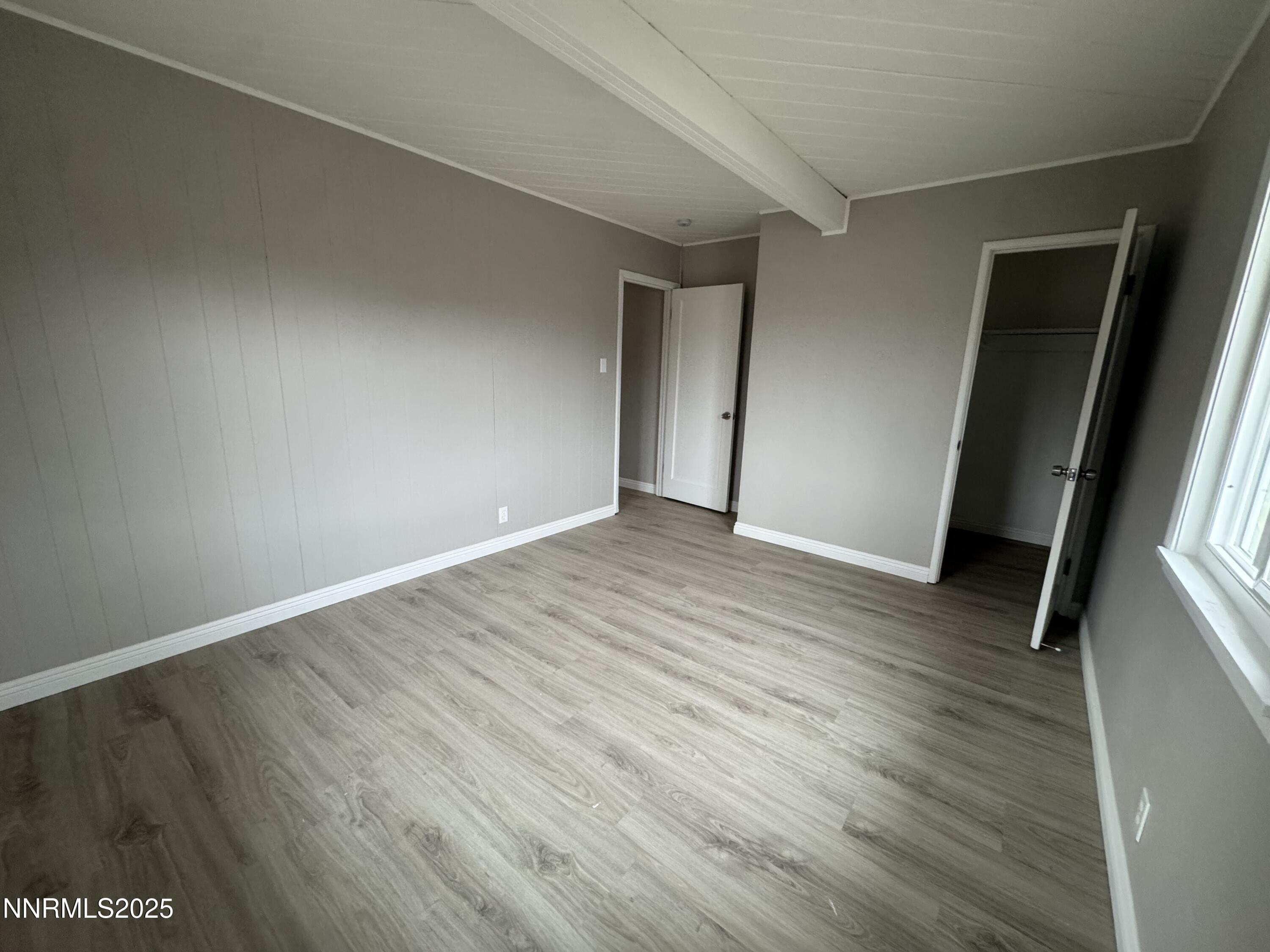 125 English Street Hawthorne, NV 89415 - Photo 11 of 16 an empty room with wooden floor and entrance