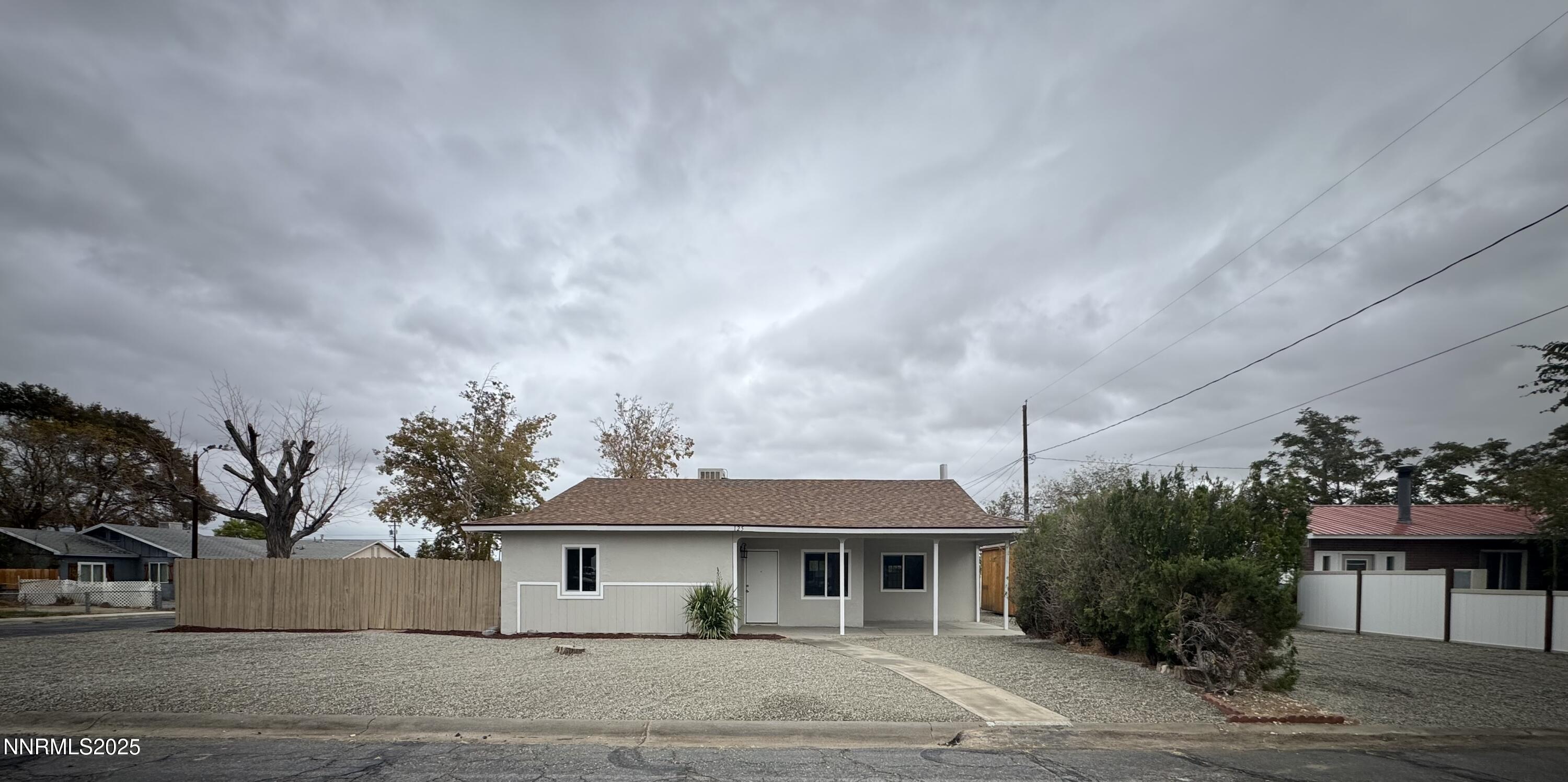 125 English Street Hawthorne, NV 89415 - Photo 2 of 16 a front view of a house with a garden