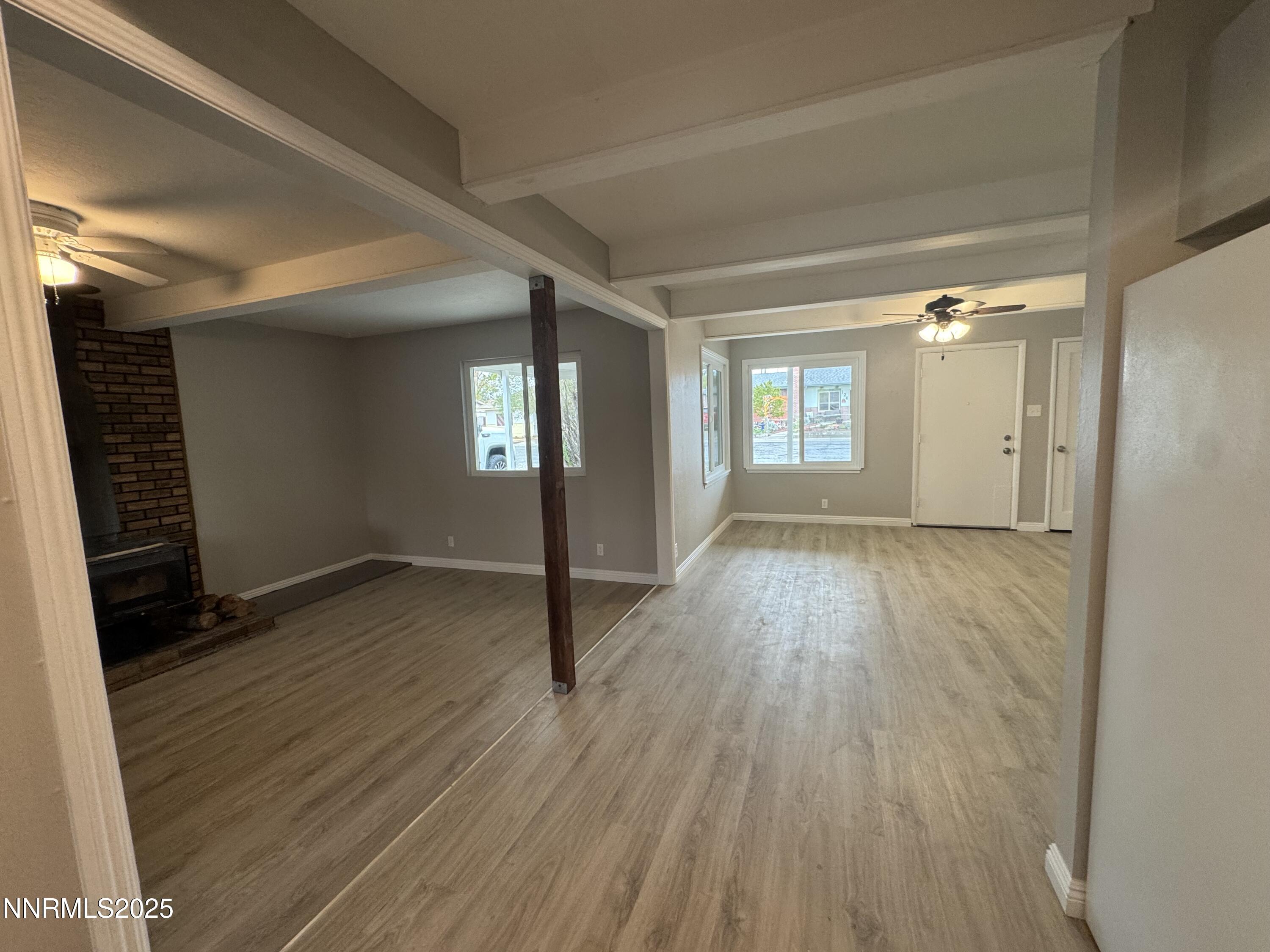 125 English Street Hawthorne, NV 89415 - Photo 9 of 16 wooden floor in an empty room with a window