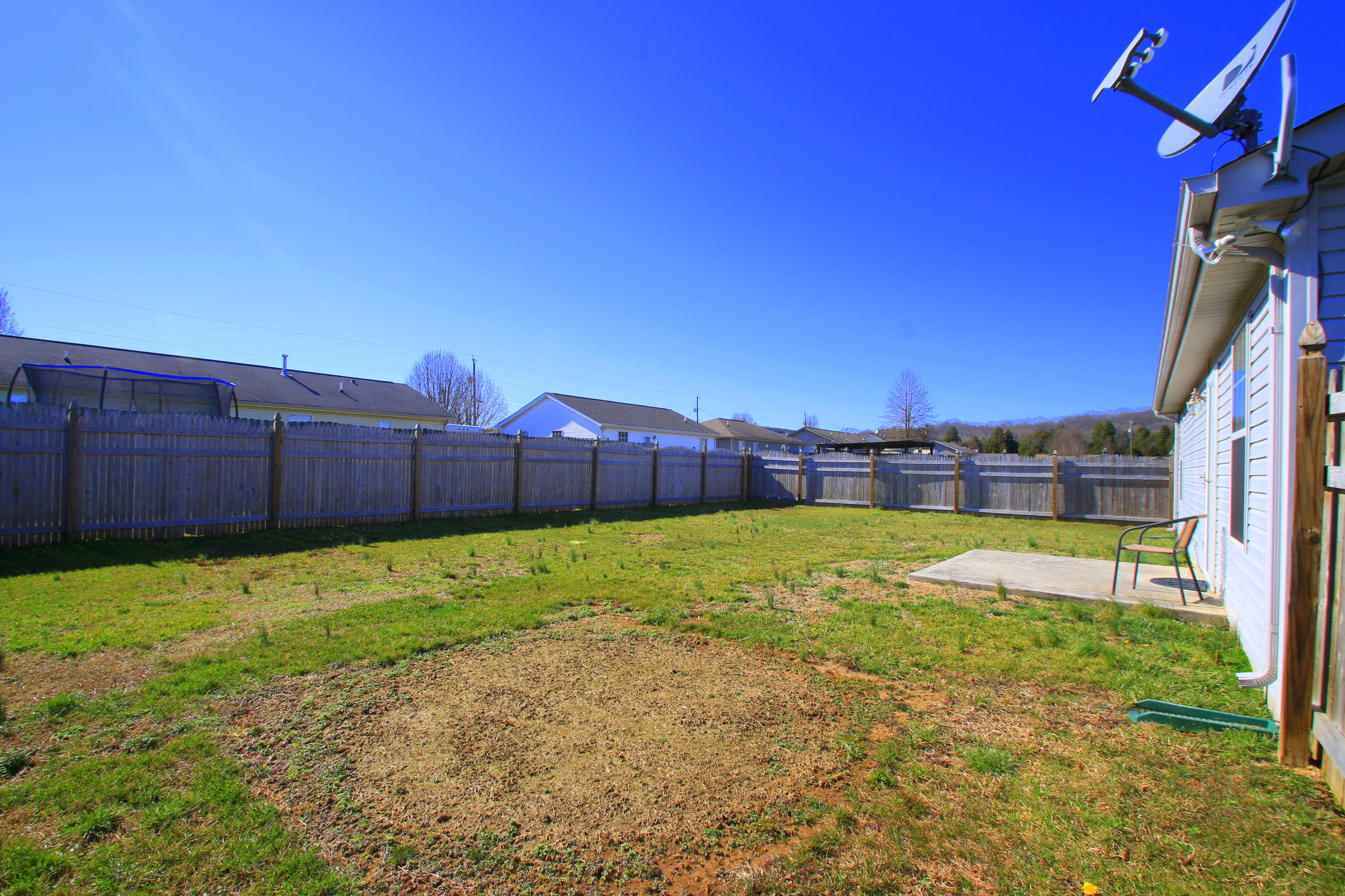 7524 Gary White Road Corryton, TN 37721 - Photo 15 of 17 Privacy Fenced Backyard