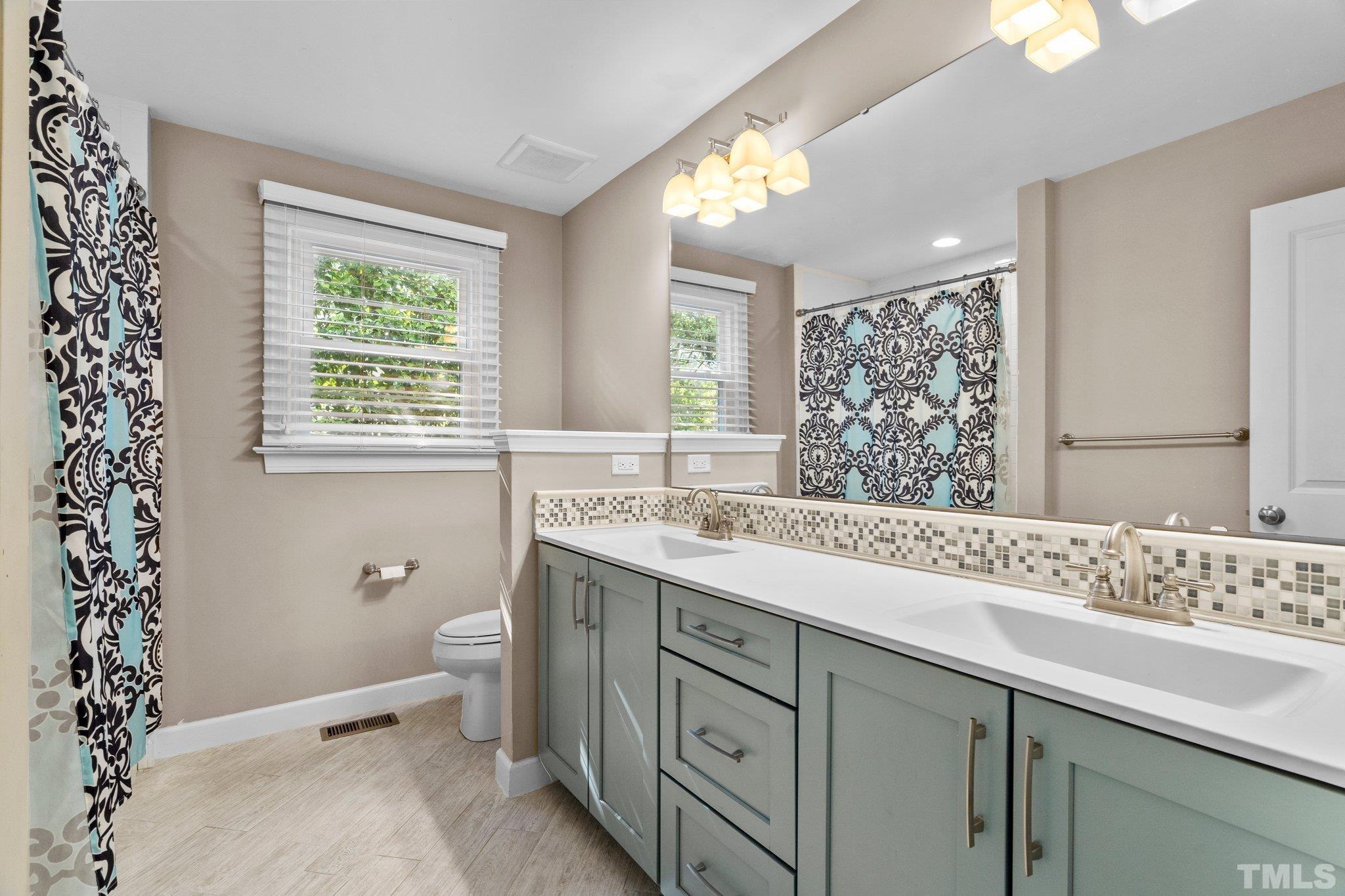 3438 Bradley Place Raleigh, NC 27607 - Photo 21 of 23 Large guest bath with double vanity