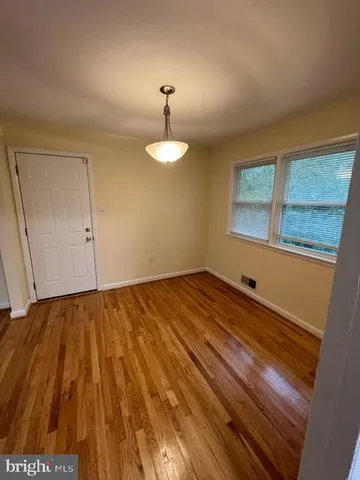 a kitchen with a refrigerator and a sink