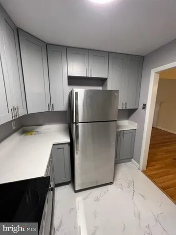 a kitchen with stainless steel appliances granite countertop a sink stove and microwave