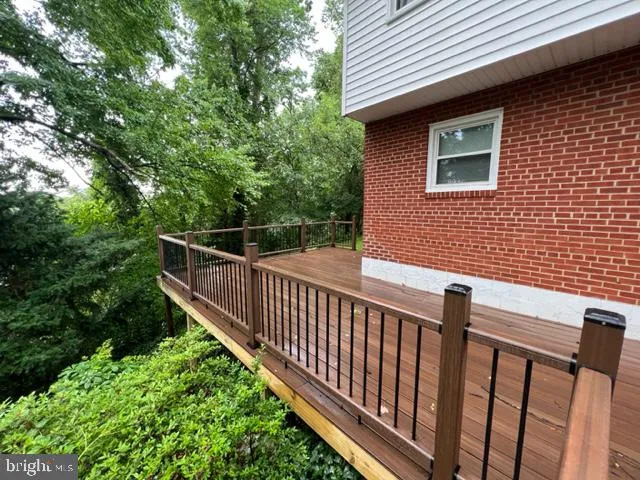 a view of a brick house with a small yard