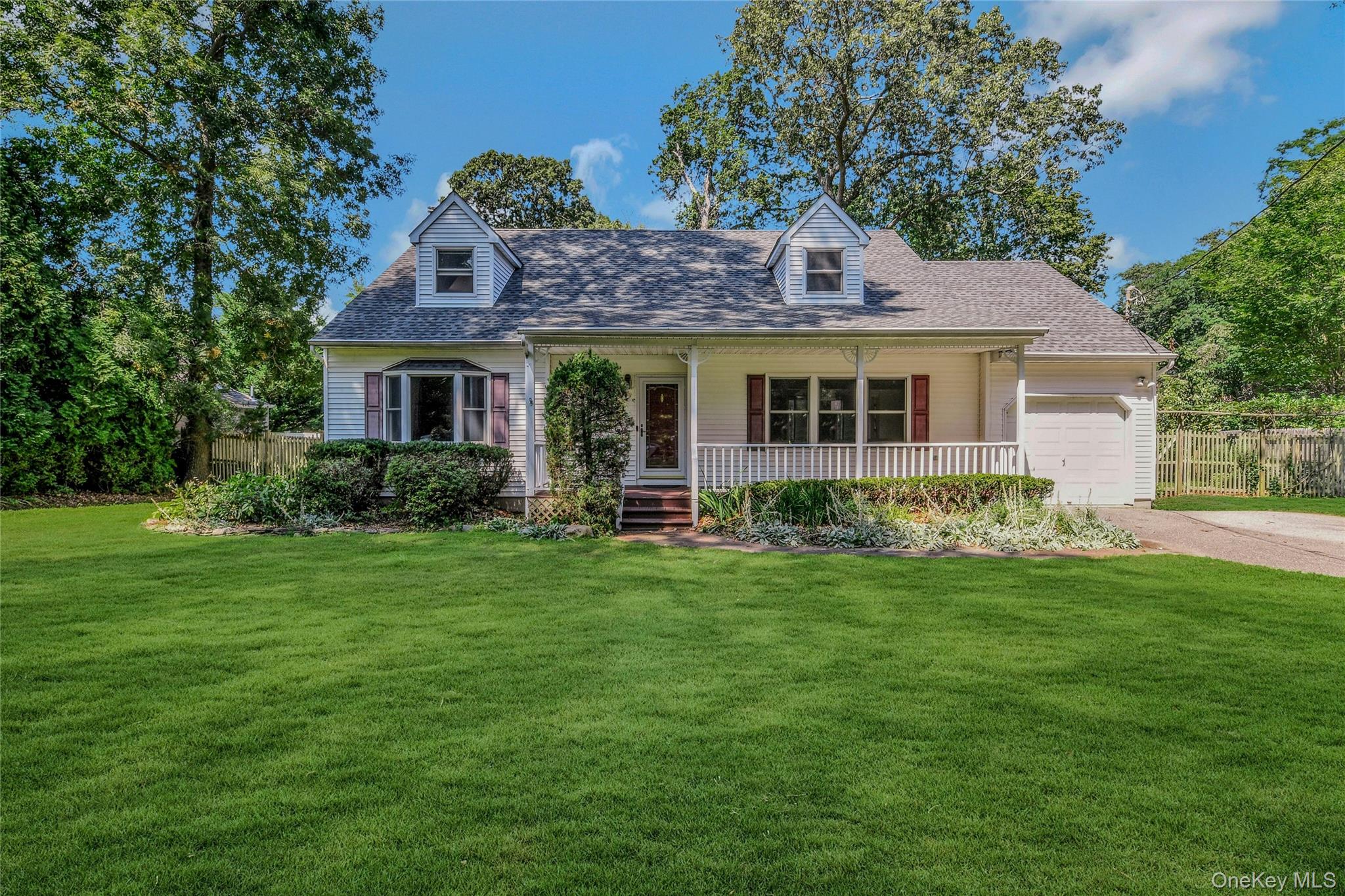7 Garden Drive Stony Brook, NY 11790 - Photo 1 of 1 a front view of a house with a yard