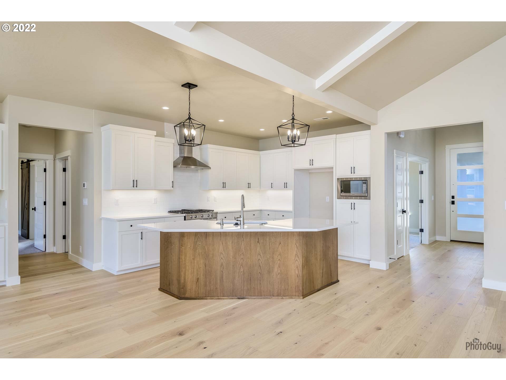 1003 South 33rd Street Springfield, OR 97478 - Photo 12 of 41 a living room with stainless steel appliances kitchen island a chandelier