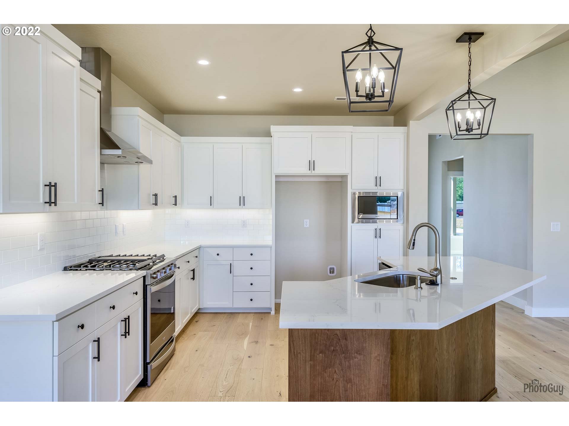 1003 South 33rd Street Springfield, OR 97478 - Photo 16 of 41 a kitchen with stainless steel appliances granite countertop a sink a stove and a refrigerator