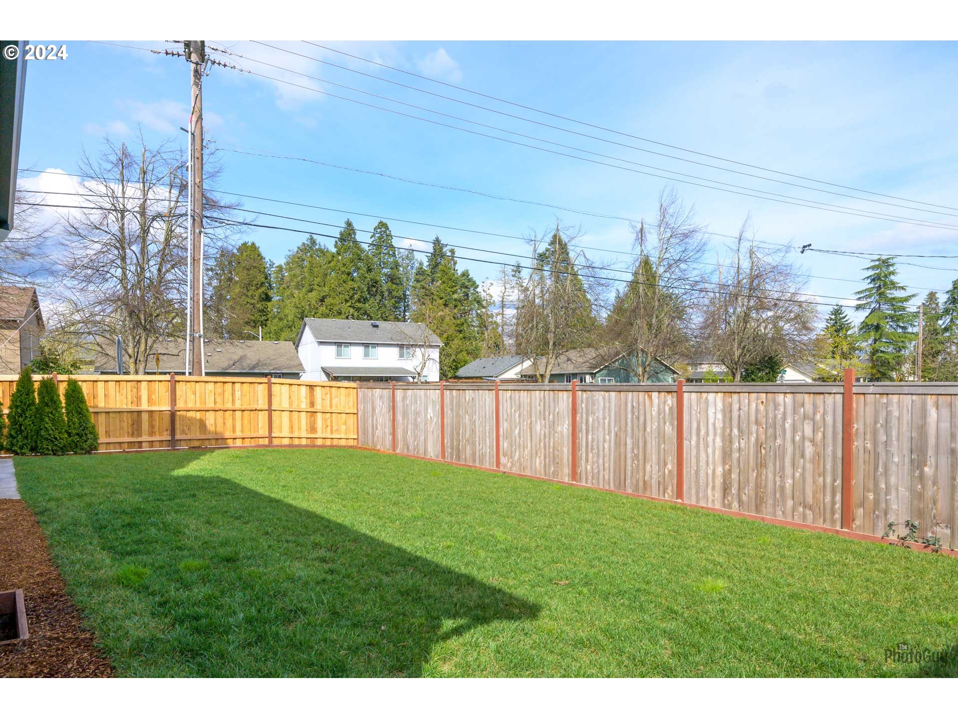 1003 South 33rd Street Springfield, OR 97478 - Photo 37 of 41 a view of a yard with wooden fence