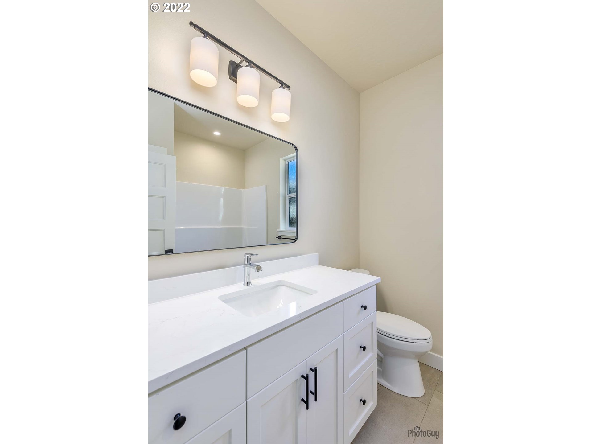 1003 South 33rd Street Springfield, OR 97478 - Photo 7 of 41 a bathroom with a sink a toilet and a mirror